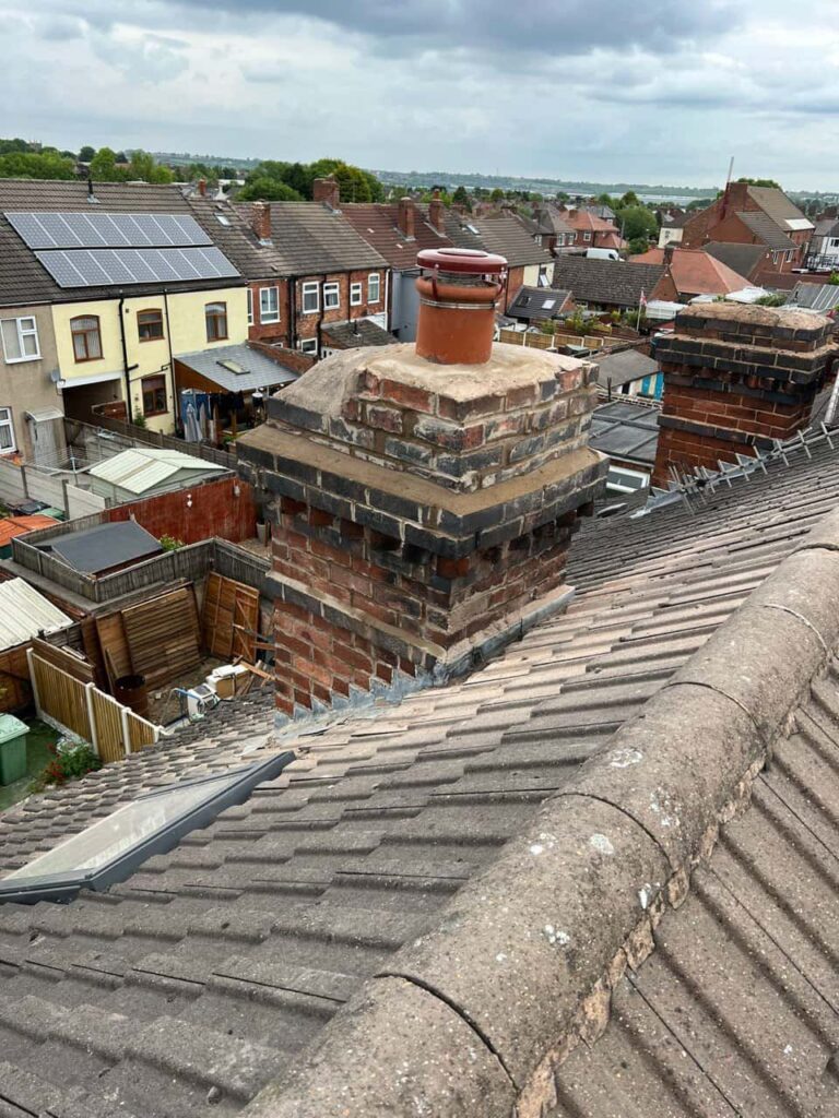 This is a photo taken from a roof which is being repaired by Chichester Roofing Repairs, it shows a street of houses, and their roofs